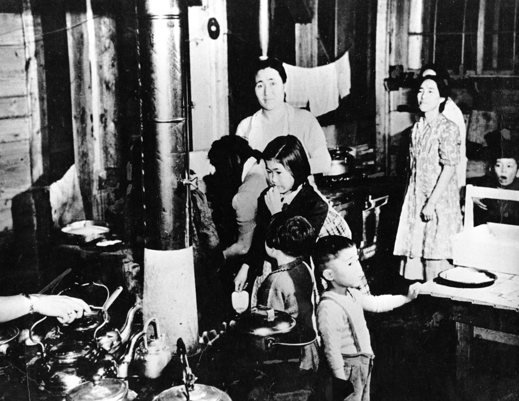 A few women and children inside a shack at Tashme internment camps