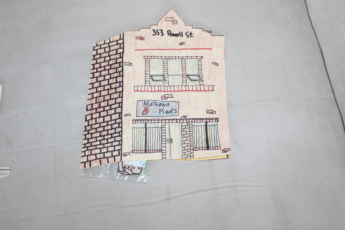 Outside of building: business below and residence on top